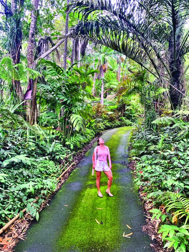 girl on road in rainforest